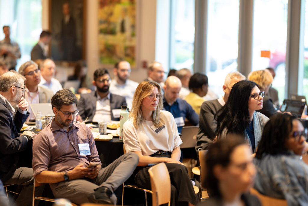 conference participants listening to a speaker